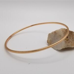 Gold tone saucer bracelet slider. B618